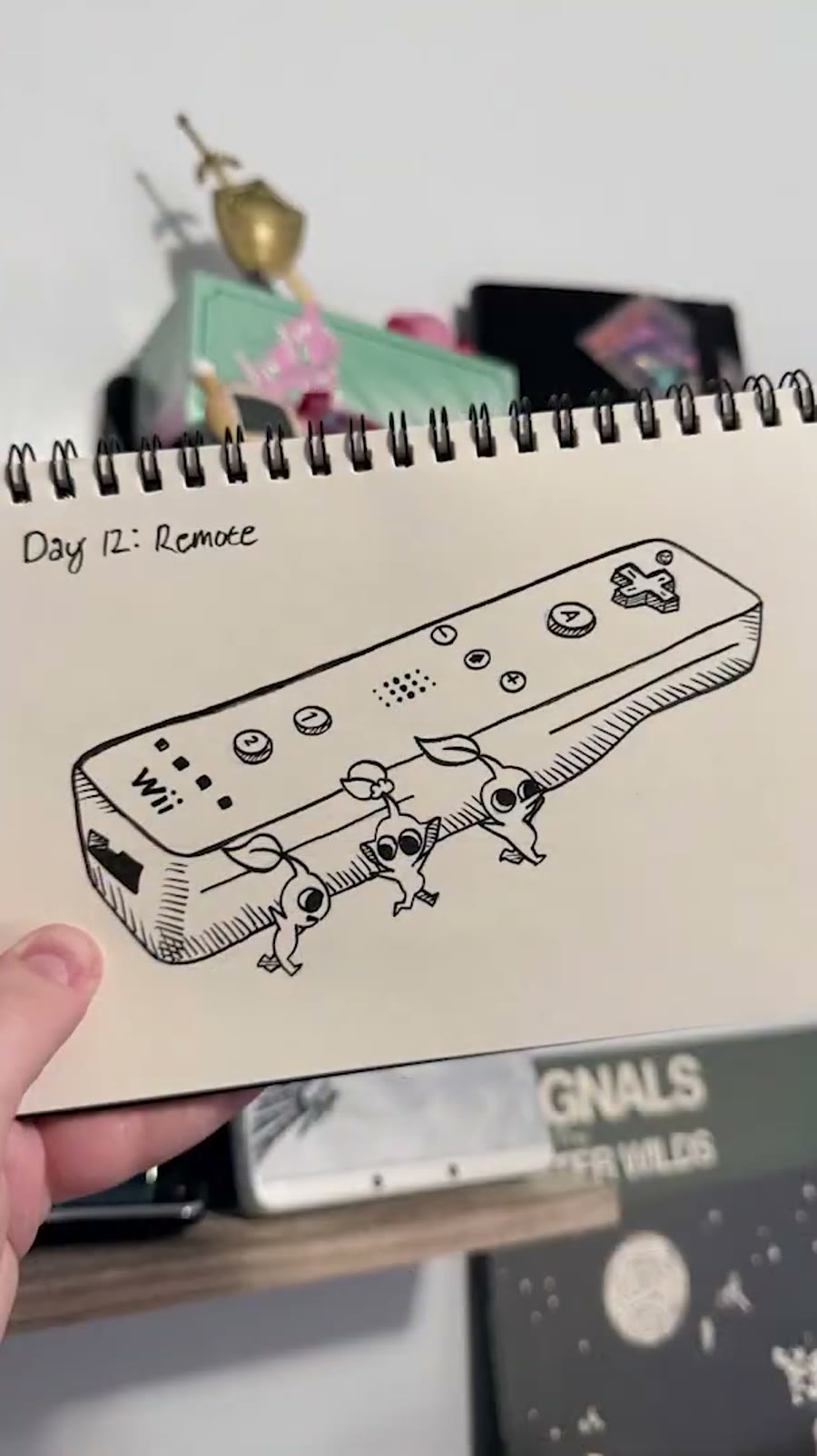 Inktober remote drawing with Pikmin carrying a Wii remote.